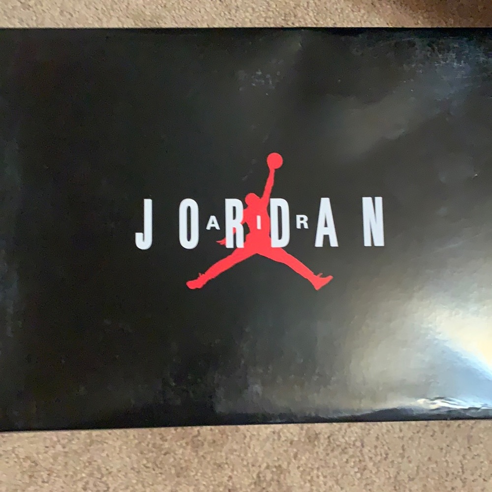 Black cement Jordan 11 IE